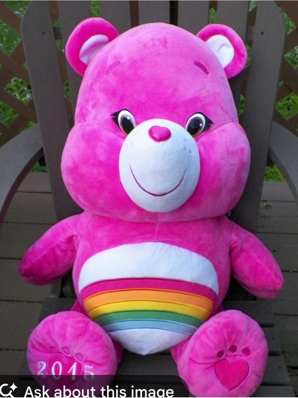 Plush Pink Care Bear Rainbow Belly Teddy Bear - callout- Rubbing on nose.